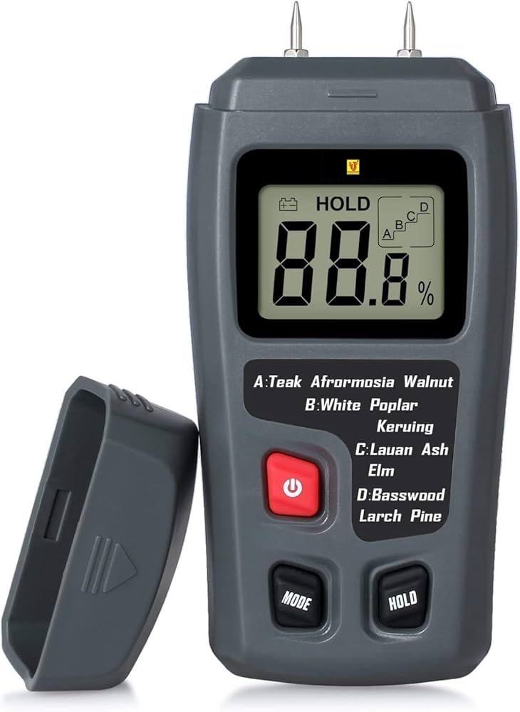 Digital wood moisture meter used to detect hidden moisture in timber and joinery